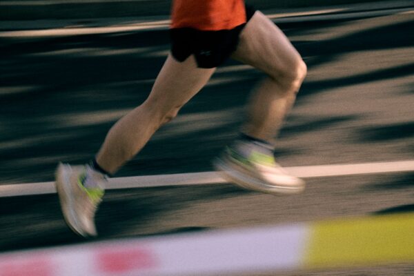 Runner's legs in motion on a track